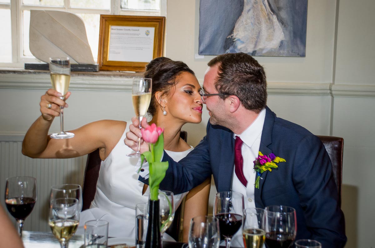 Tash and Raf embrace at their wedding reception in Borde Hill, Haywards Heath.