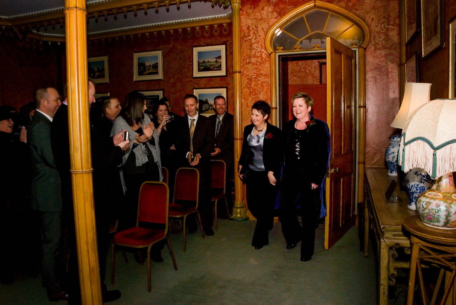 Laura and Paula are greeted by guests  inside Brighton Dome before their civil partnership.