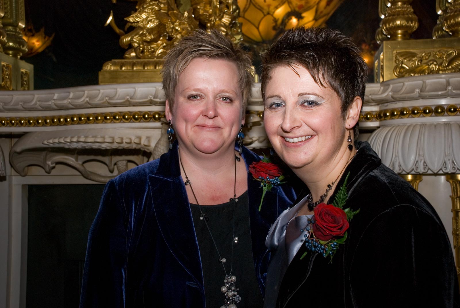 laura an Paul smile inside Brighton Dome after their civil partnership.