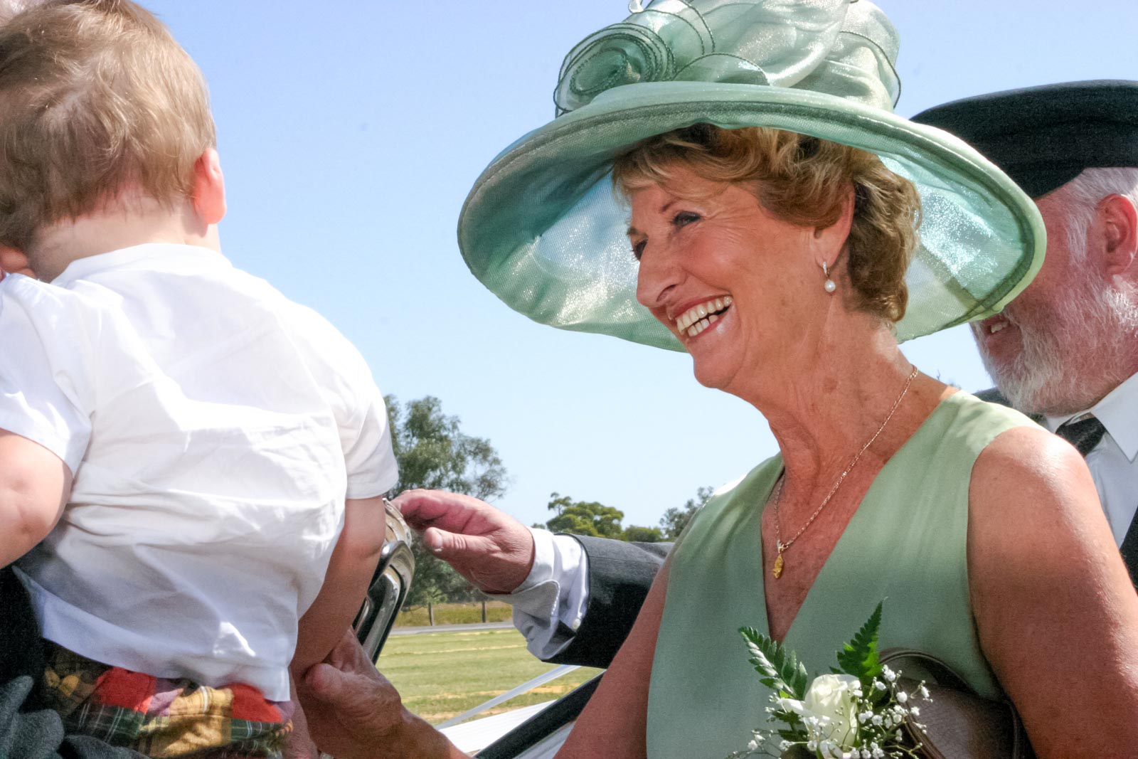 The mother of the bride greets guests at Russ and Megs wedding.