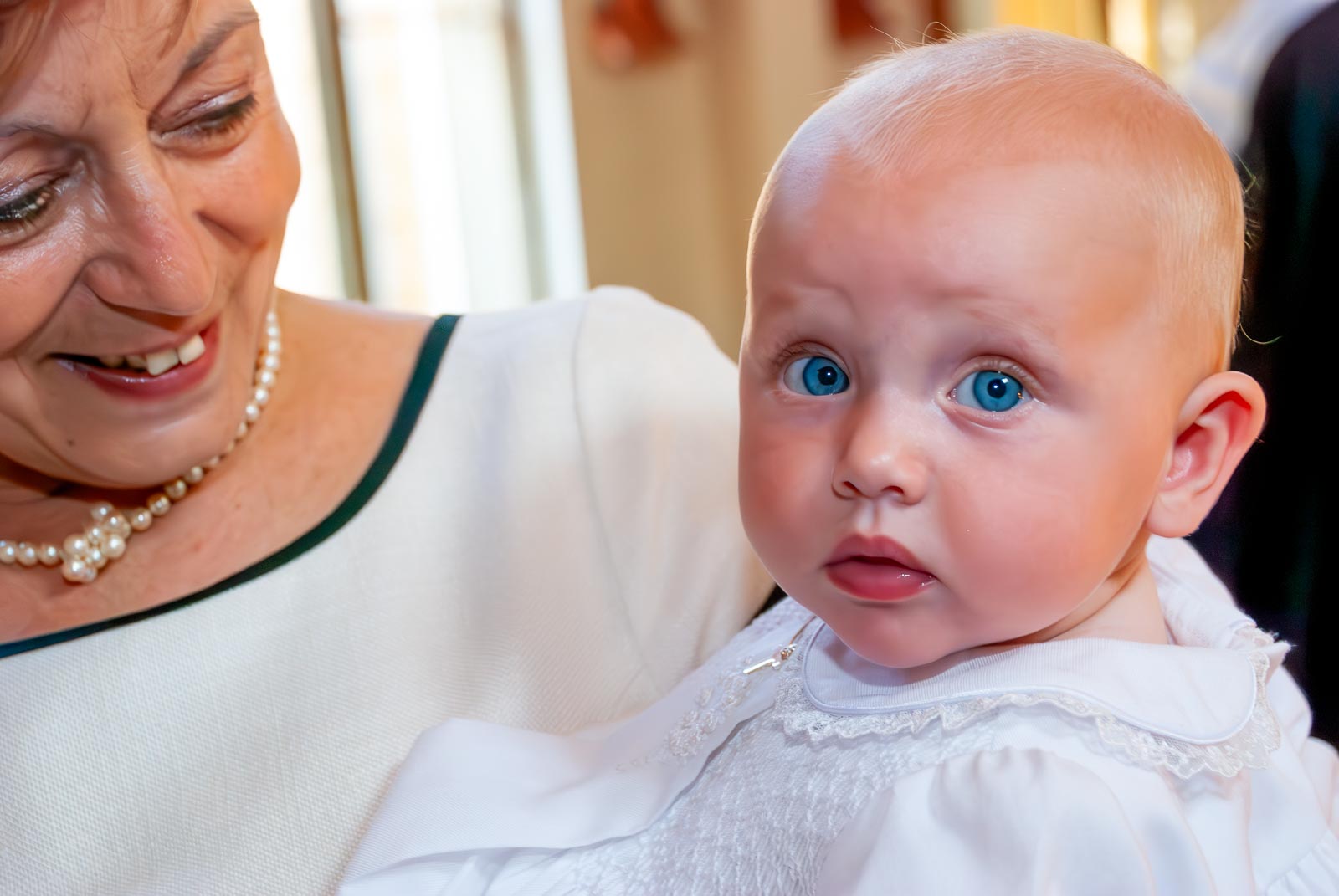 Amalie smiles before being baptised.