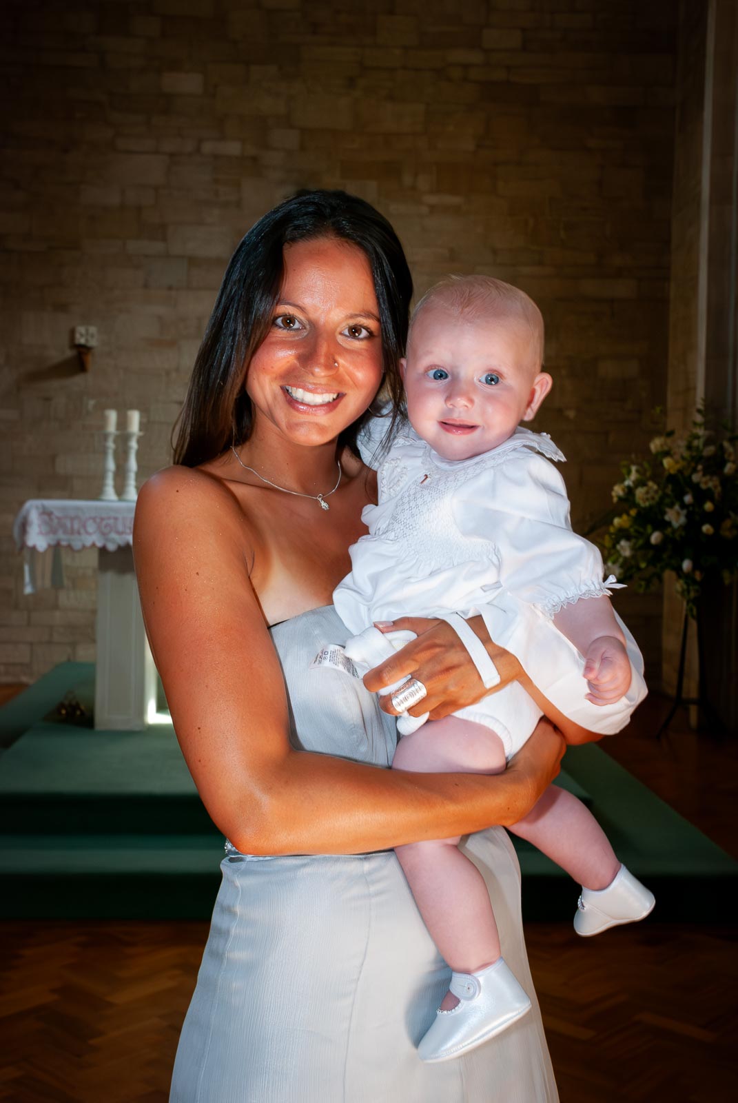 Amalie and her mum pose in the church after her baptism.