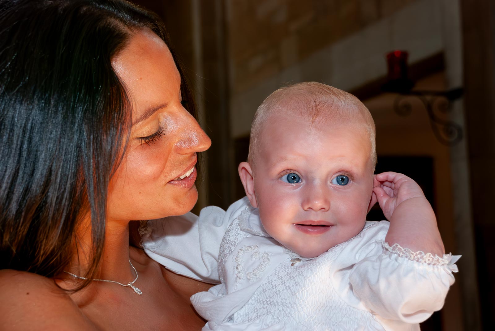 Amalie and her mum pose in the church after her baptism.