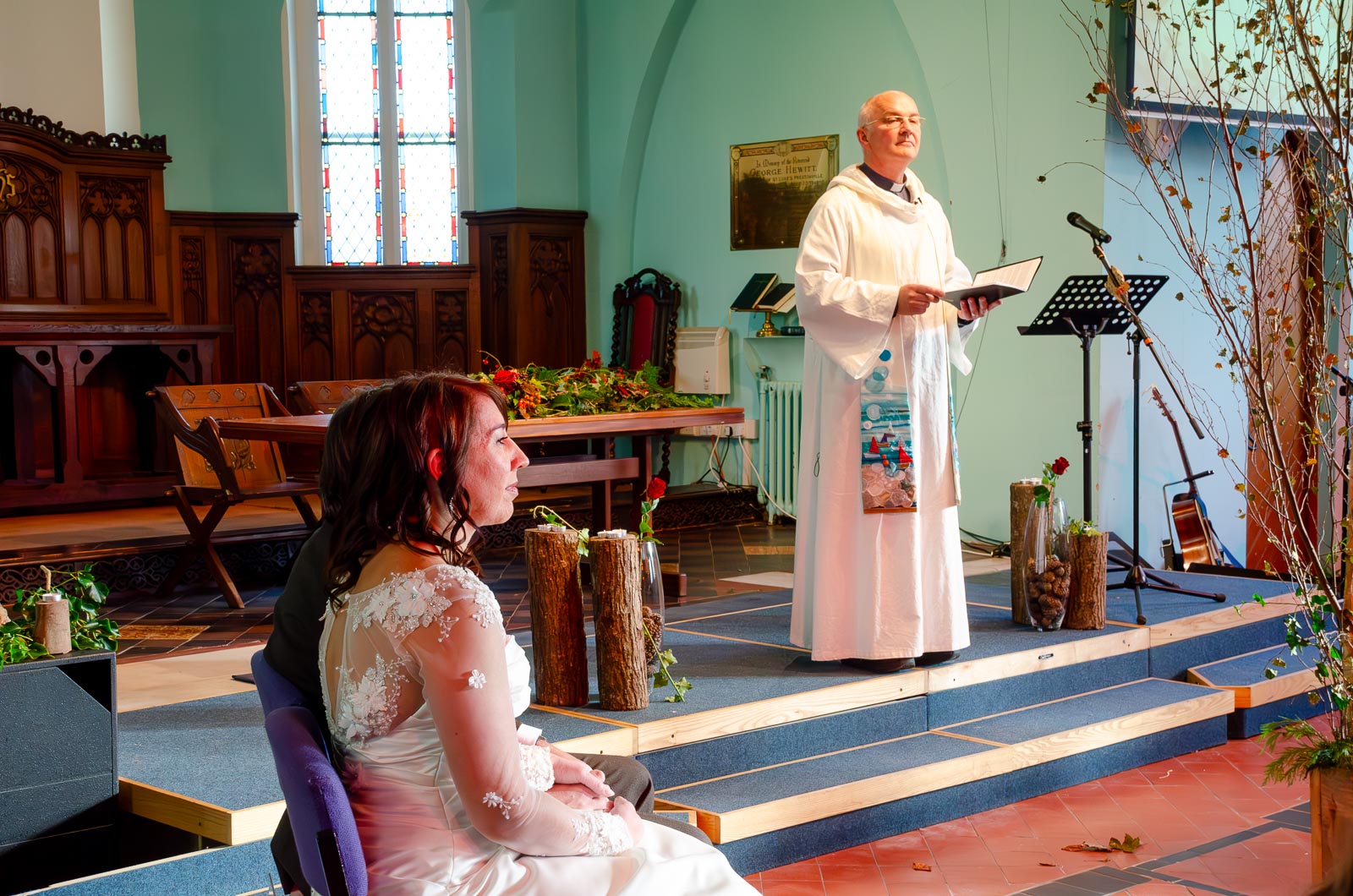 Jon and Lou give their vows during their wedding at St Michaels Church in Brighton.