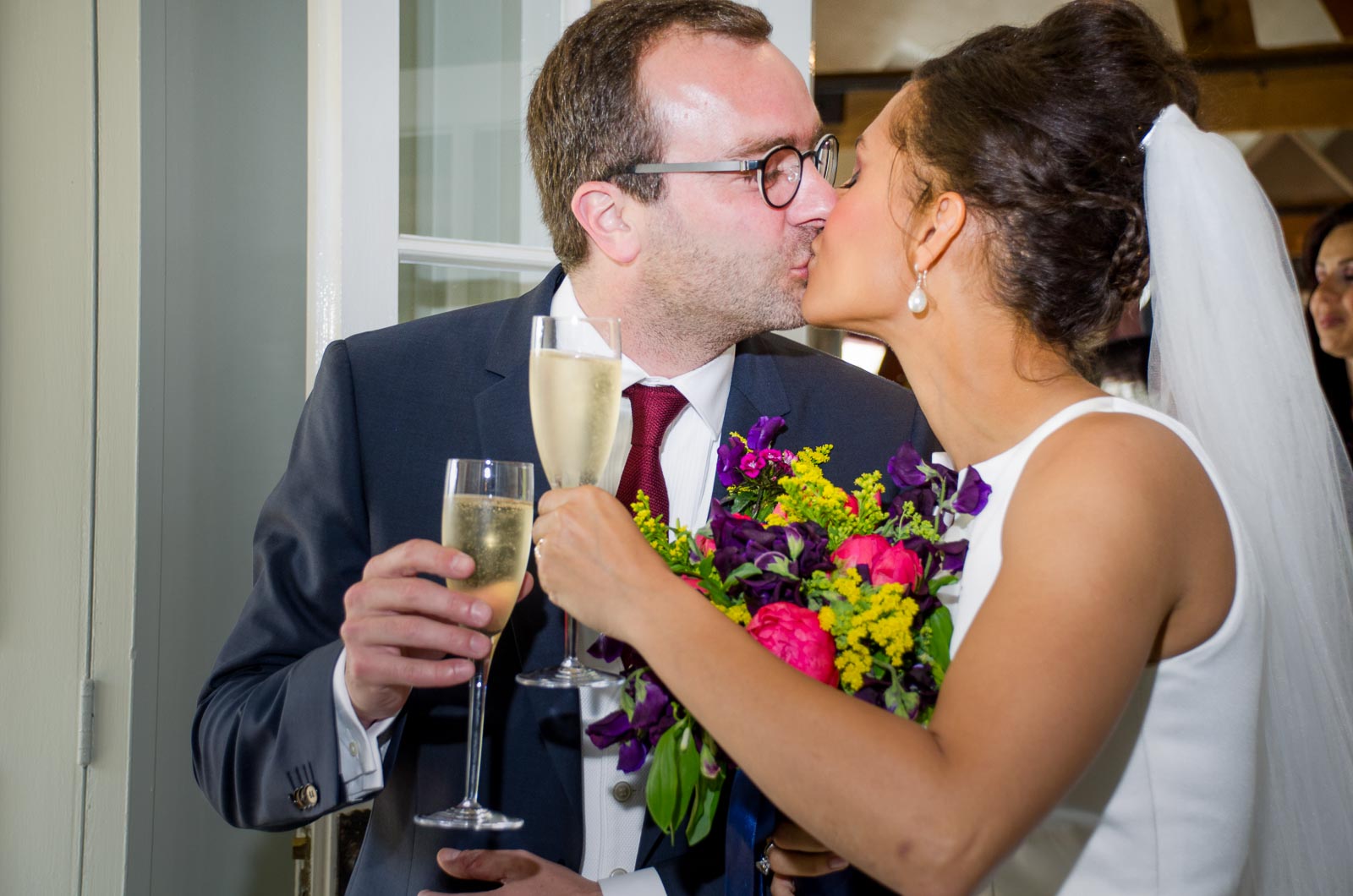 Tash and Raf embrace during their wedding reception in Borde Hill, Haywards Heath.