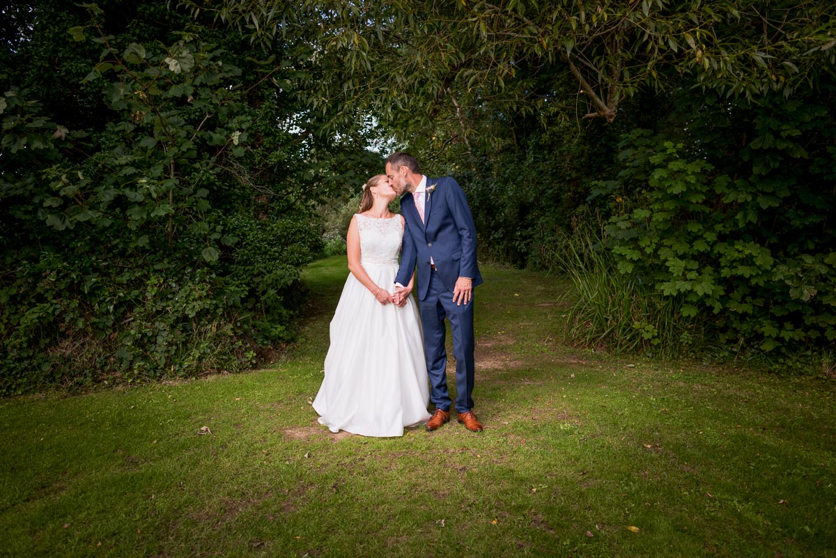 Donna and Andy embrace at their wedding reception.