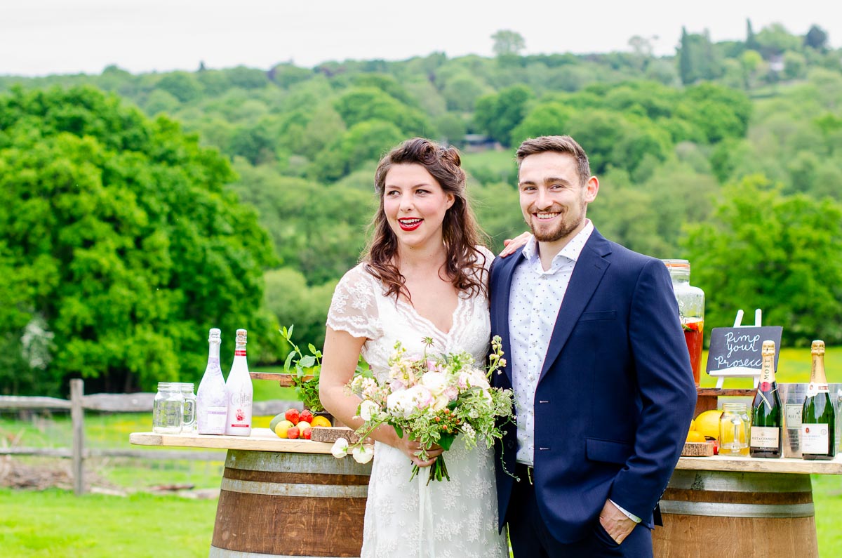 Toni and Luke enjoy the view over Ashdown Forest at the wedding reception in Nutley Edge