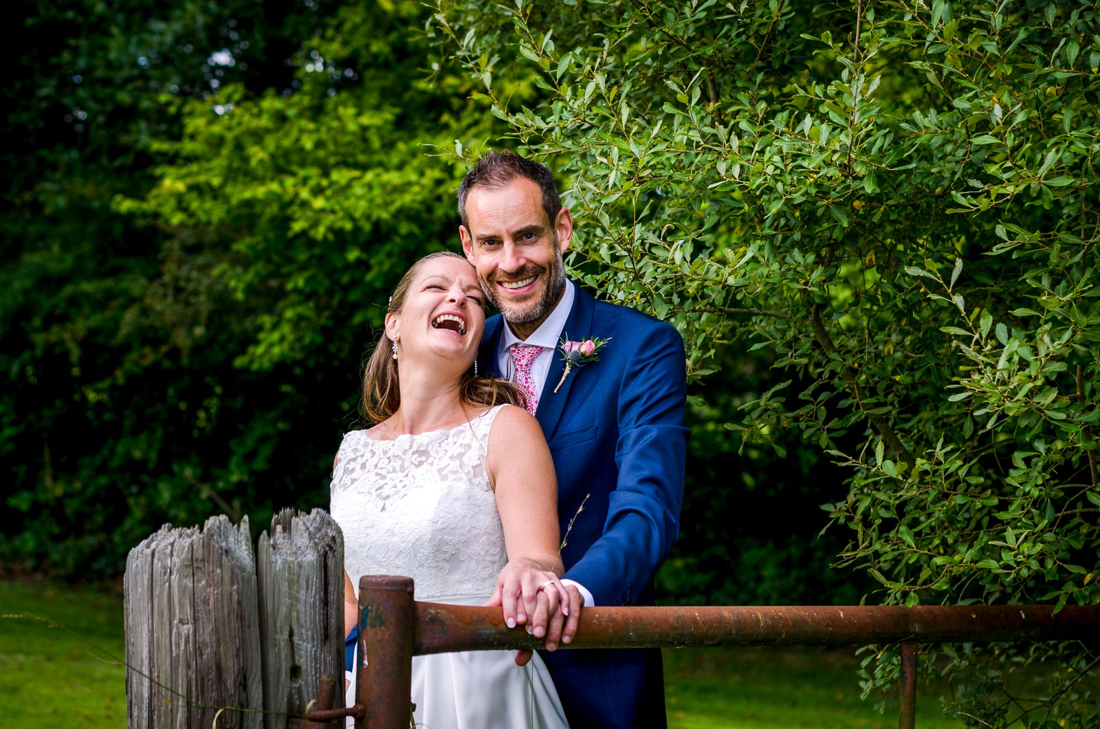 Donna and Andy laugh at their wedding reception.
