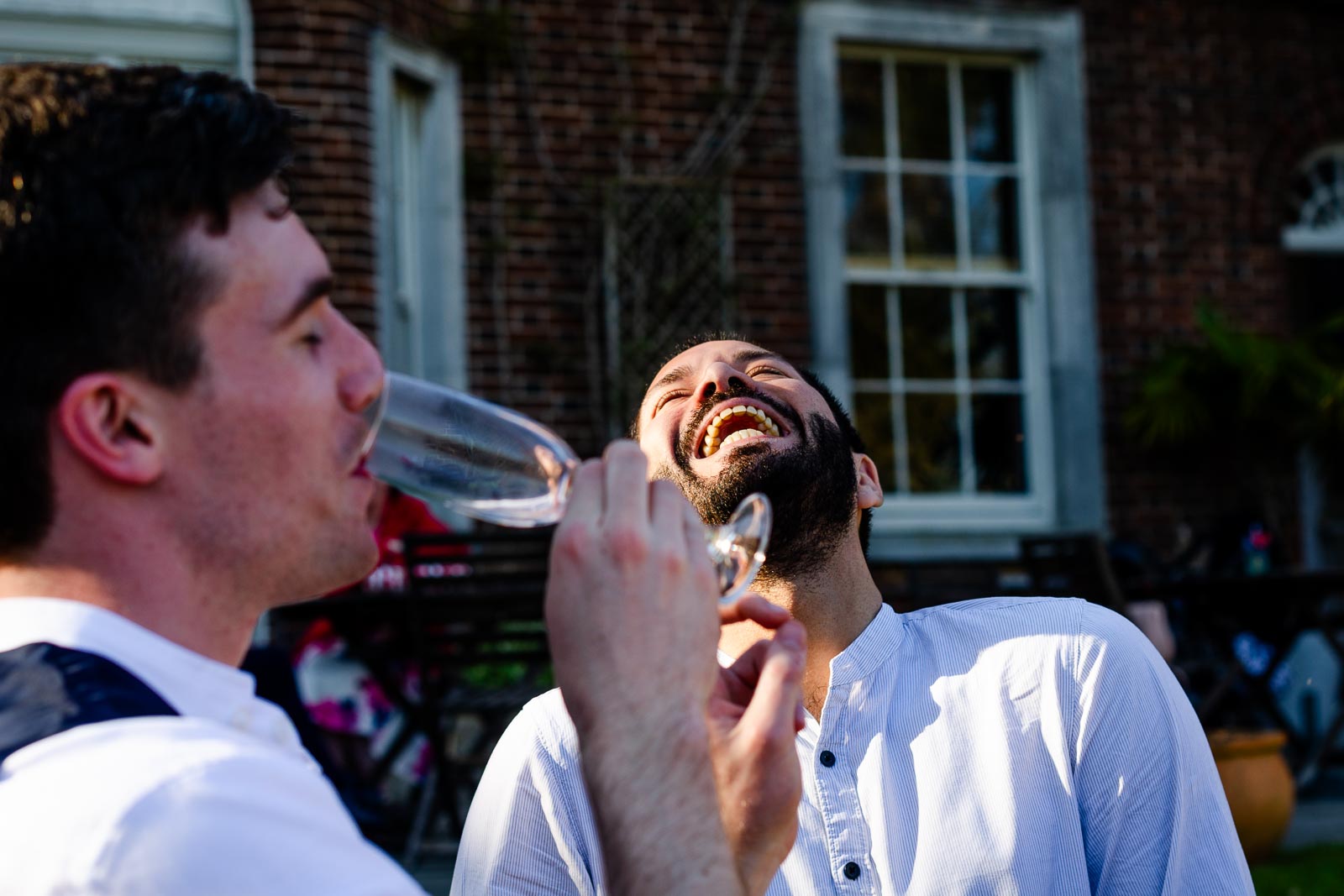 Guests laugh in the garden of Pelham House Hotel, Lewes.