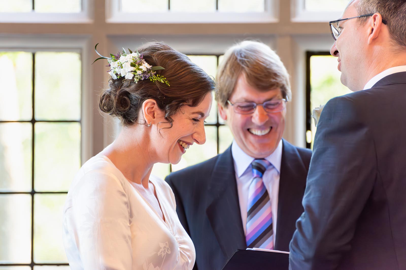 Alexis smiles as she delivers her vows to Niell during their wedding in the Ainsworth Room at Lewes Registry Office before his wedding.