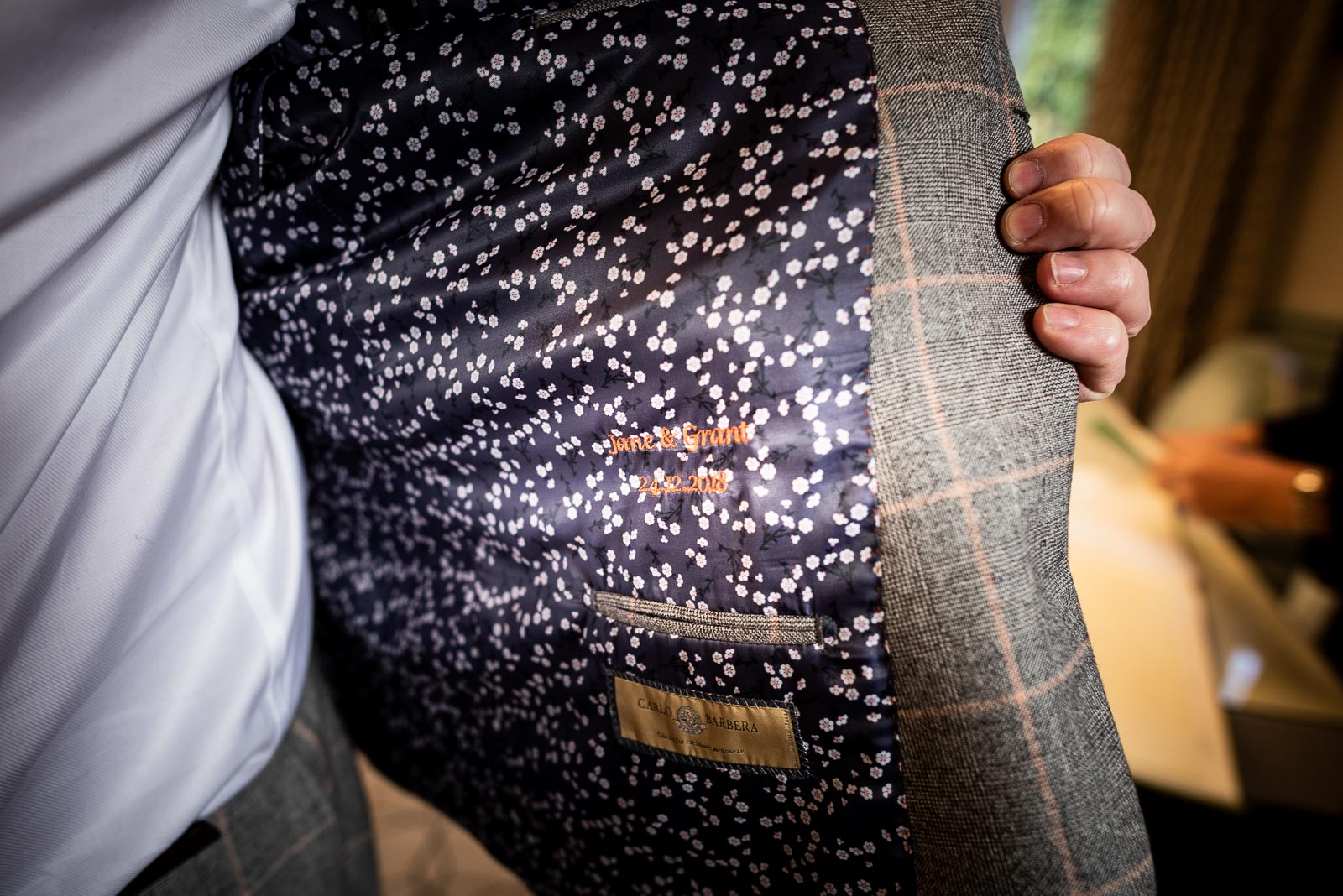 Grant shows the lining of his jacket which has a embroidered note in the lining commerating his wedding to Jane at Lewes Register Office.