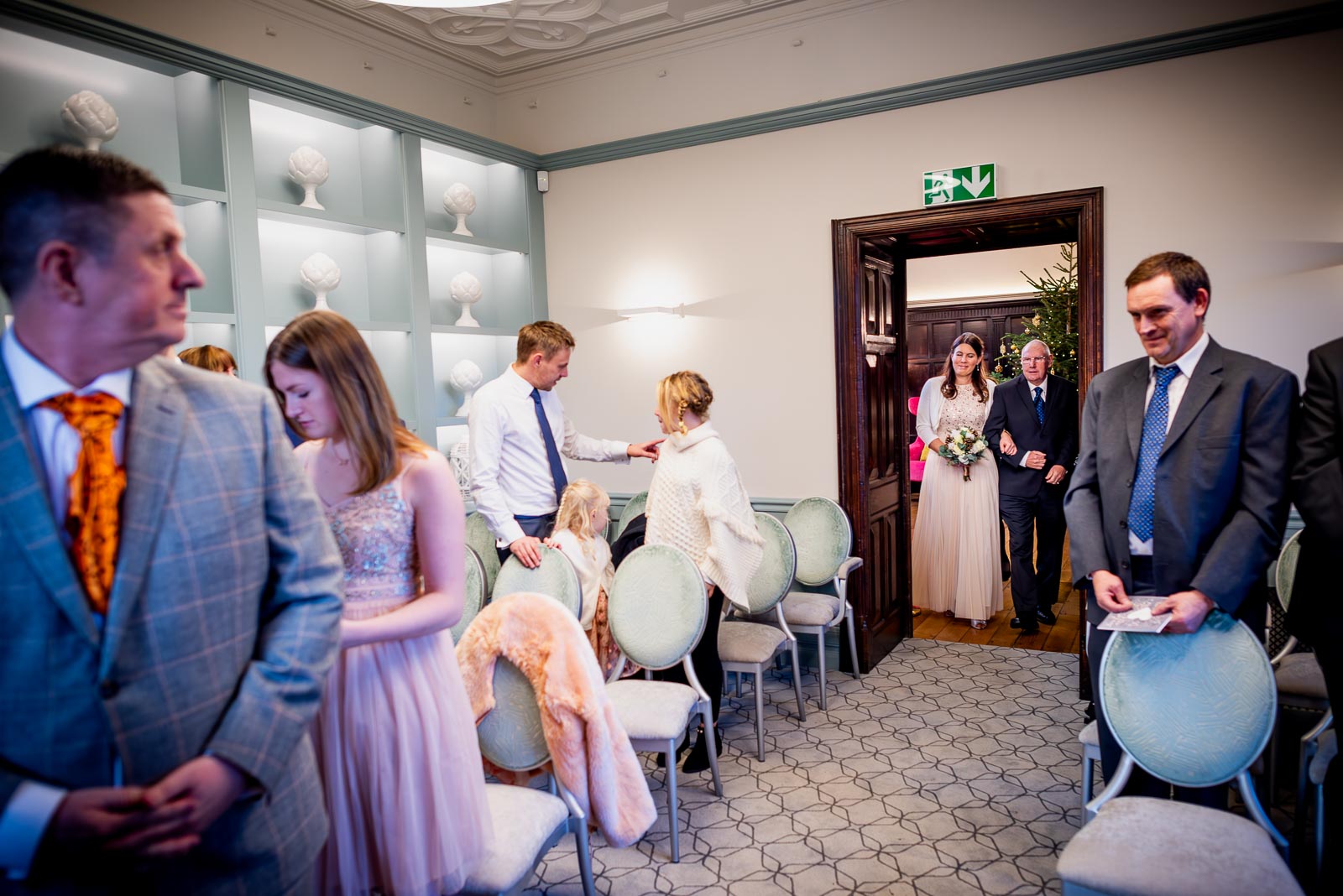 Jane enters the Evelyn Room at Lewes Register Office accompanied by her father before her wedding to Grant.