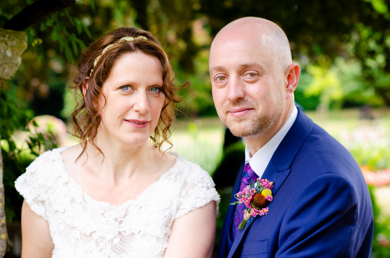 Katherine and Ben look at the camera in Southover Grange after their wedding at Lewes Register Office.