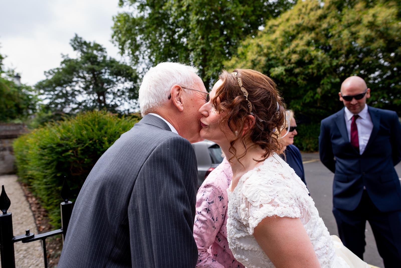 Katherine welcomes guests outside Lewes Register Office before her wedding to Ben.