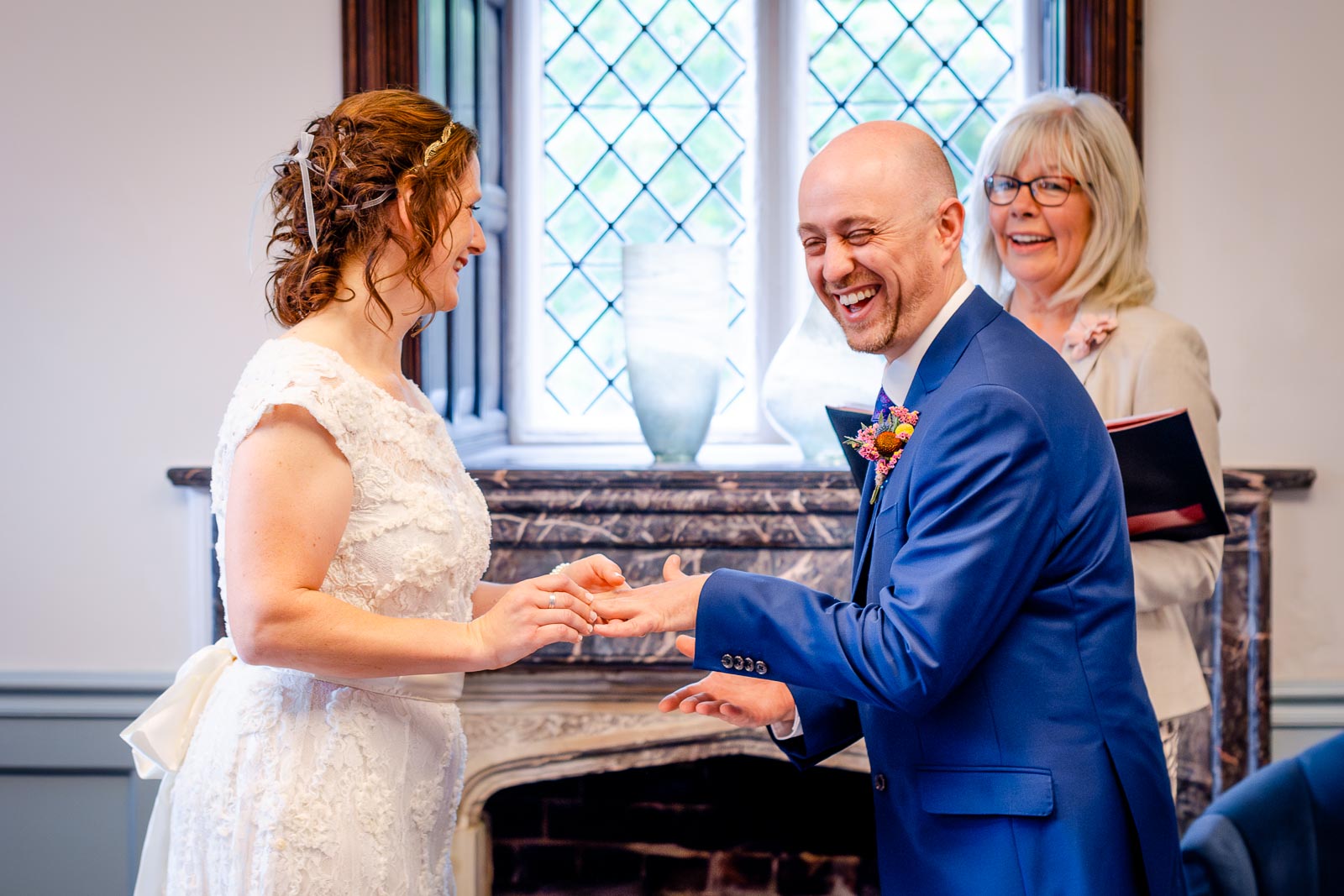 Ben laugh's as Katherine try's to put on his Wedding Ring in the Ainsworth Room at Lewes Register Office.