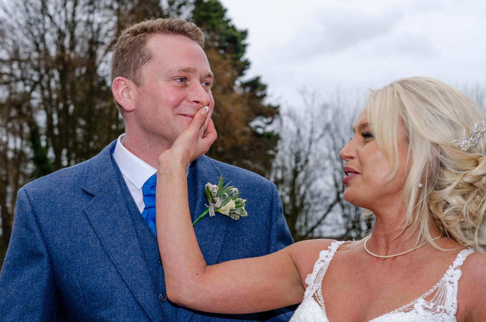 Eilidh wipes lipstick from Lewis's face after their wedding.