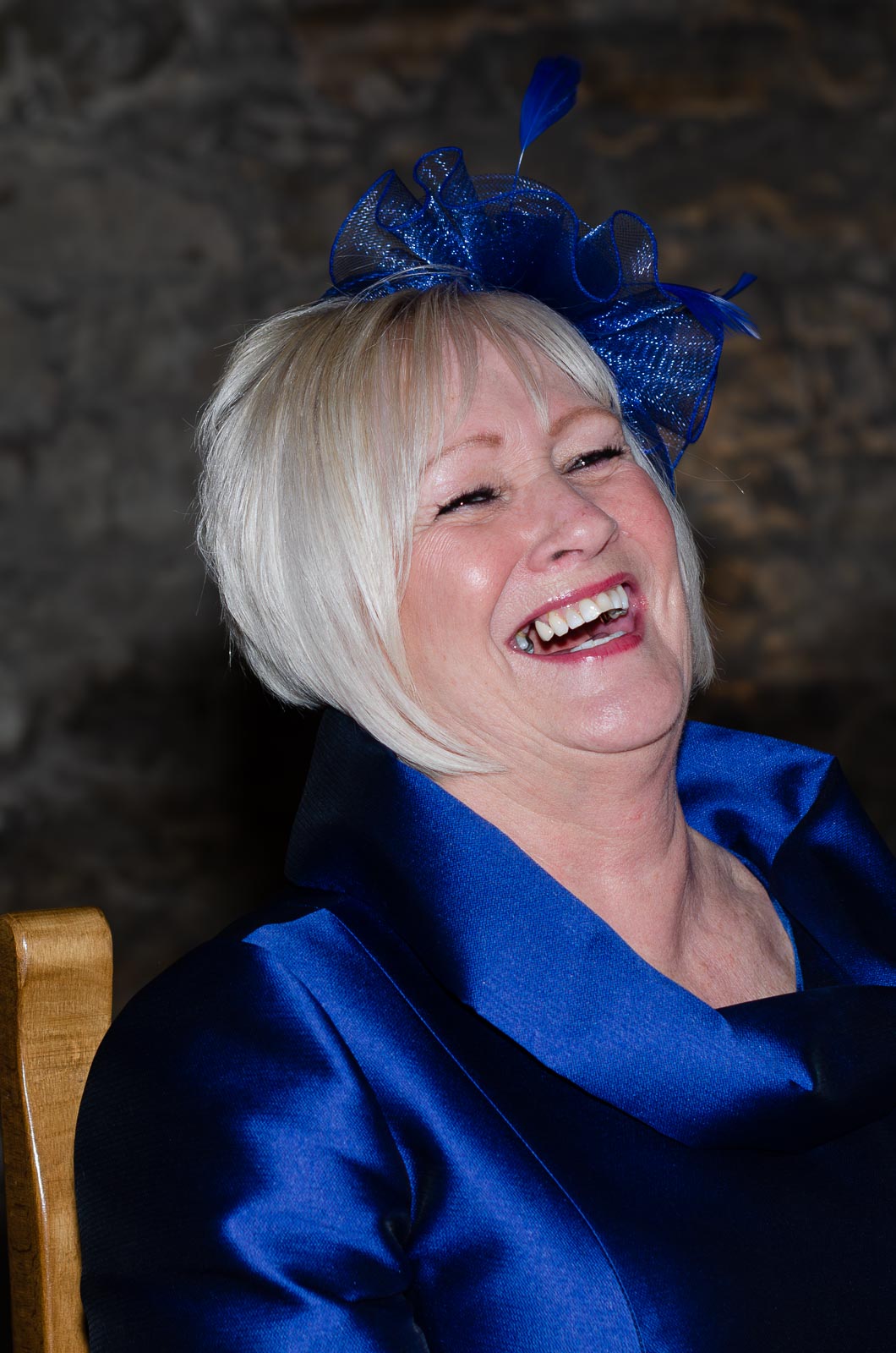 Lewis's mum laughs at their wedding.
