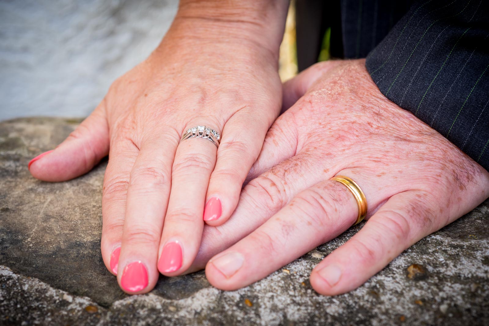 a close up shot of Wendy and Chris's wedding rings in Southover Grange after their wedding at lewes Register Office.