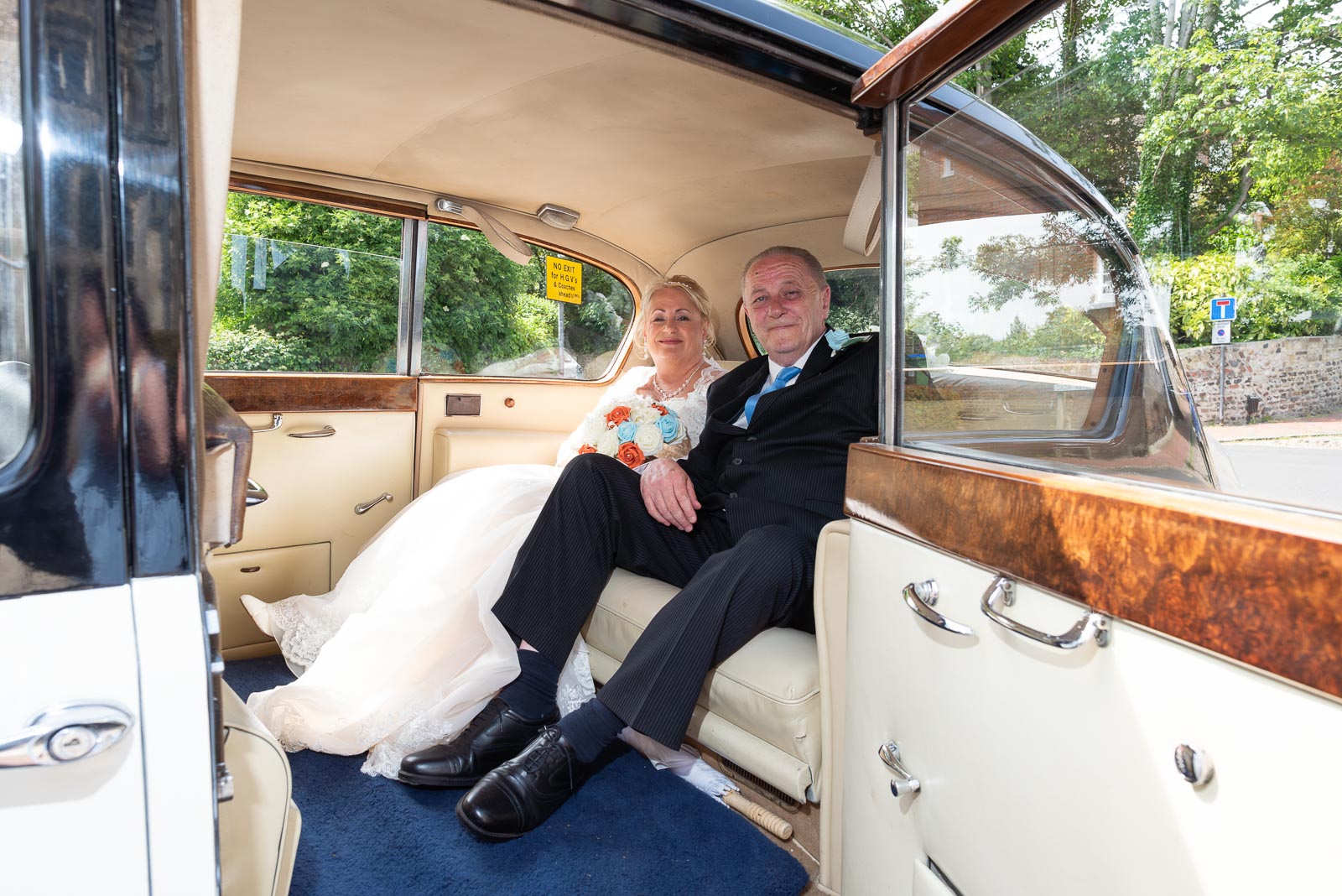 Wendy arrives at Lewes Registry Office in a white, wedding car with her brother.