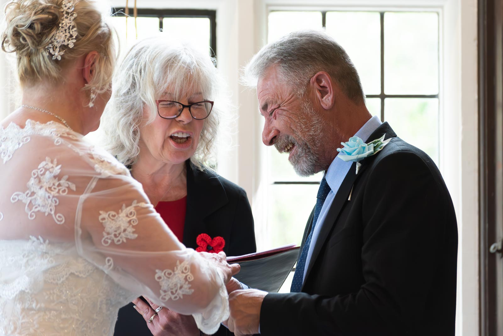 Jason laughs as he delivers his wedding vows in the Ainsworth Room at Lewes Register Office.