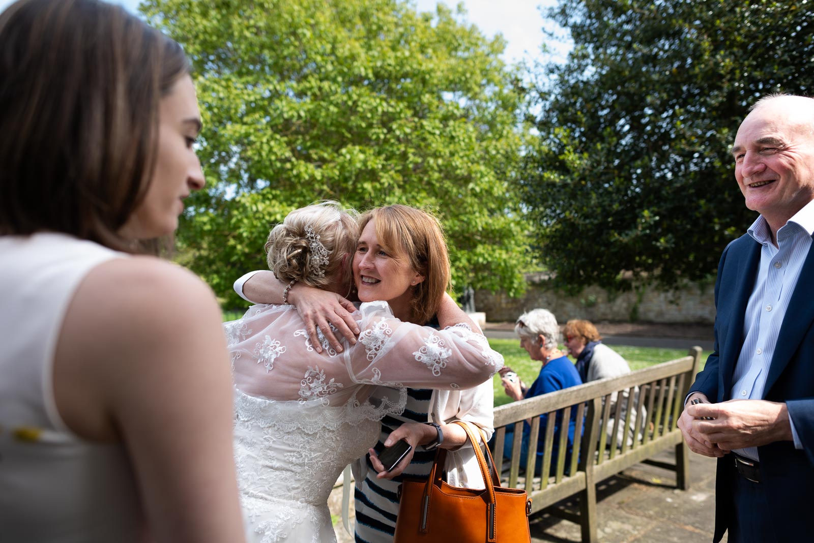 Wedding guests embrace outside the back entrance of Lewes Register Office.