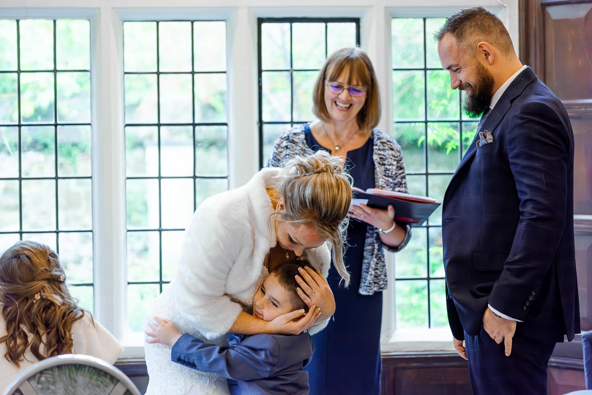 Laura embraces her son at the top of the aisle in the Ainsworth Room in Lewes Register Office during her wedding to Sam.