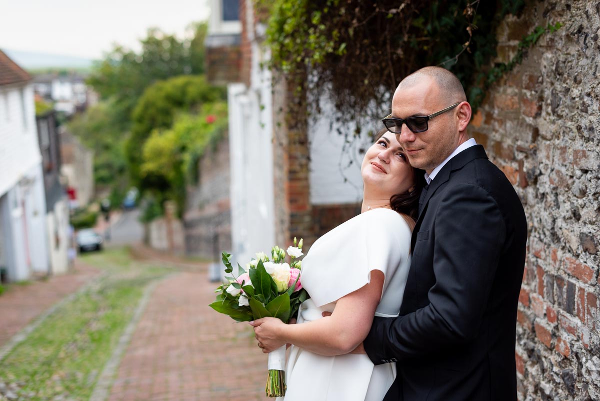 Maria and Robert pose at the top of Keere Street in Lewes after their wedding in Lewes Register Office.