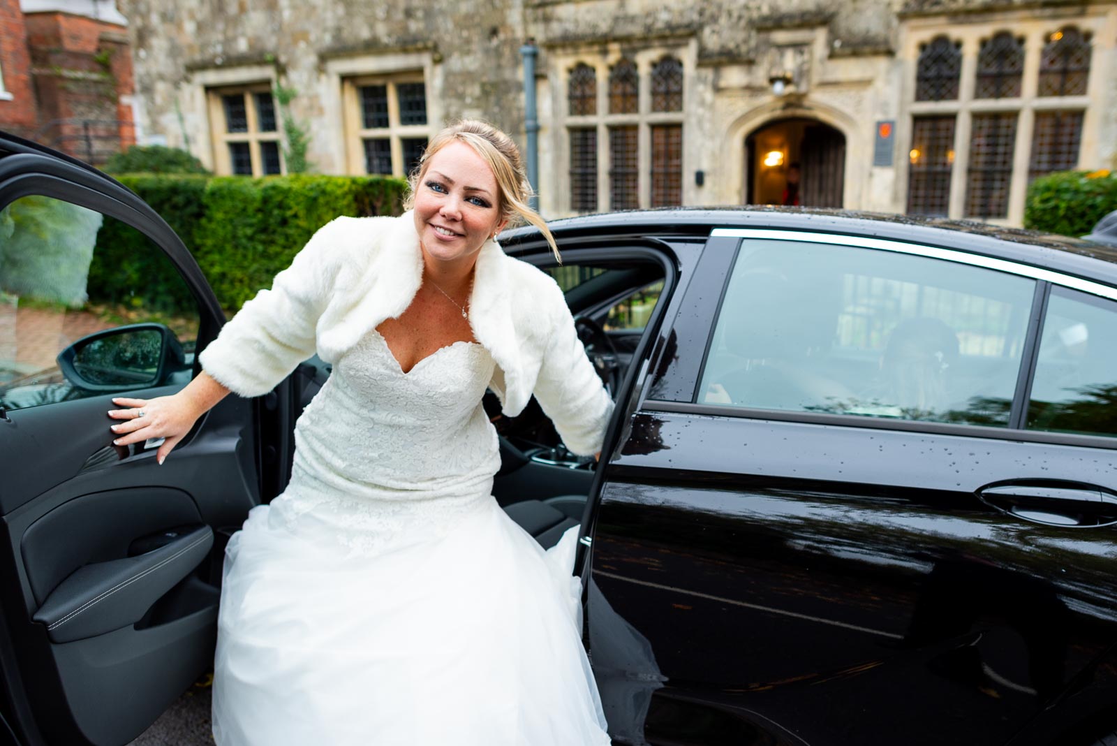 Laura arrives in a black wedding car at the from of Lewes Register Office before her wedding to Sam.