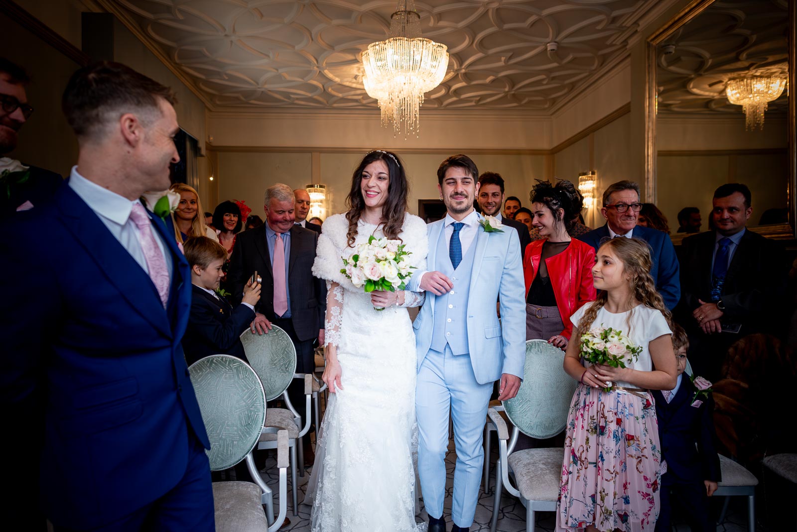 Simon greets Virginia at the top of the aisle in the Ainsworth Room, Lewes Register Office before their wedding.