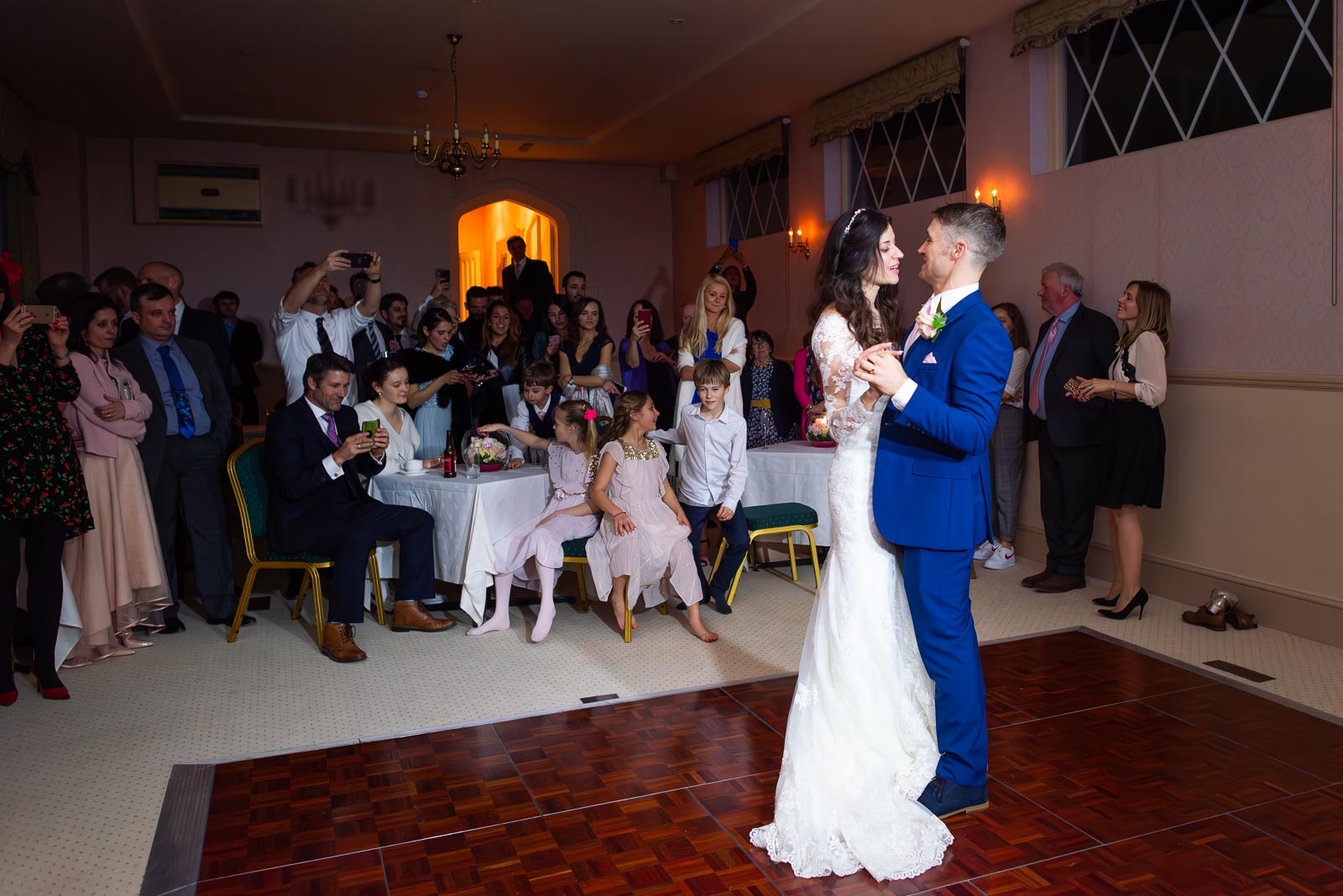 Virginia and Simon enjoy their first dance in the company of their wedding guests in Horsted Place Hotel.