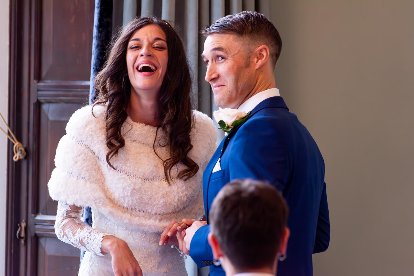 Virginia and Simon enjoy a funny moment during their wedding in the Ainsworth Room, Lewes Register Office.