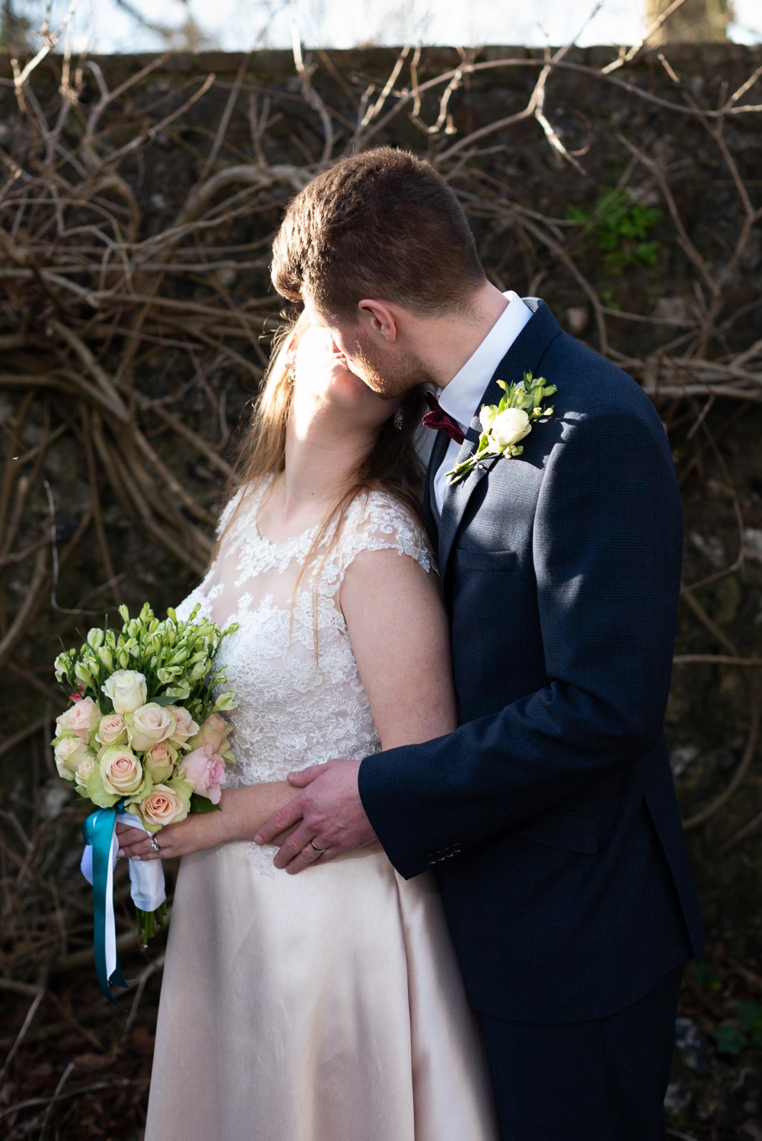Belinda and Chris embrace in Southover Grange after their wedding at Lewes Register Office.