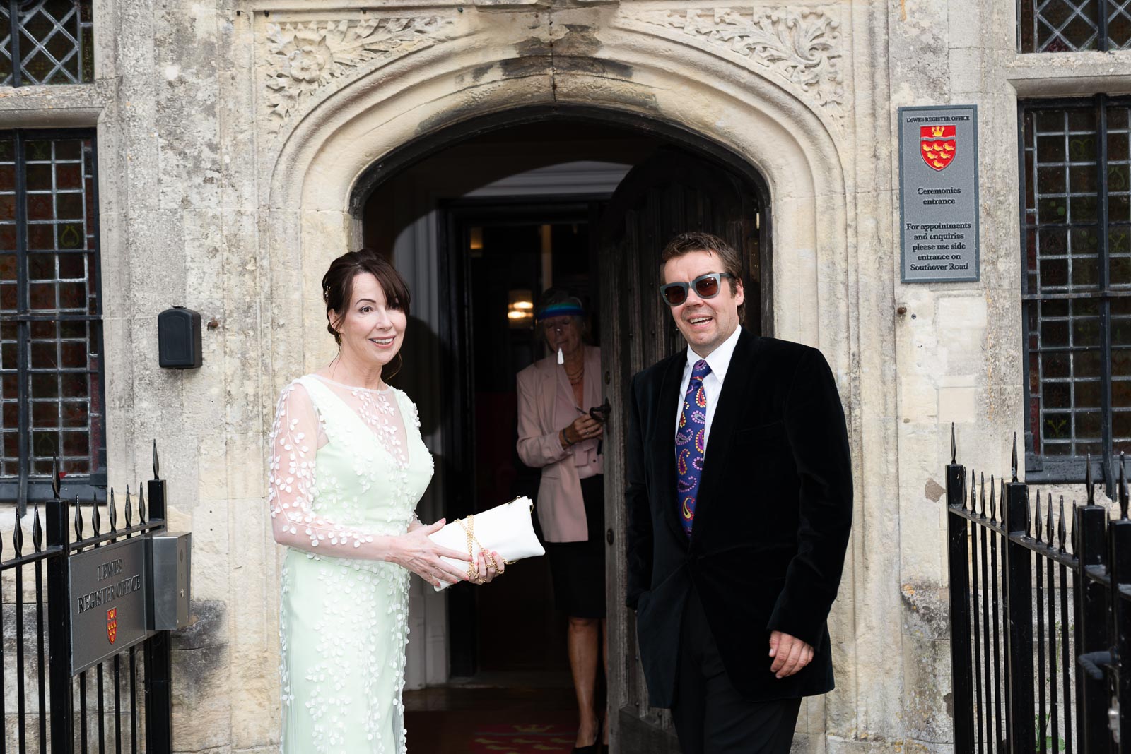 Fiona and Richard stand outside Lewes Register Office before their wedding.
