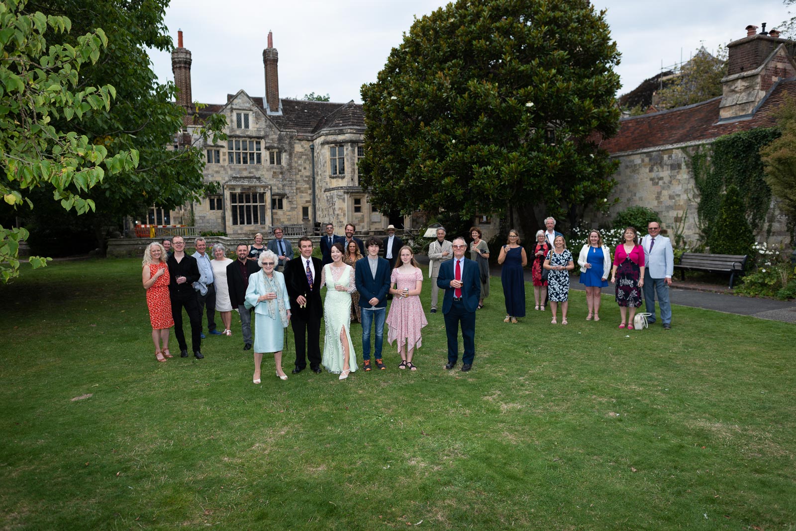 A large group photo of Fiona and Richard's wedding guests in Southover Grange, Lewes.