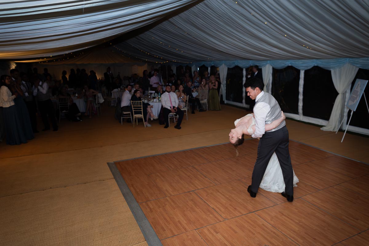 Lly and Callum enjoy their first dance after their wedding in Iford.