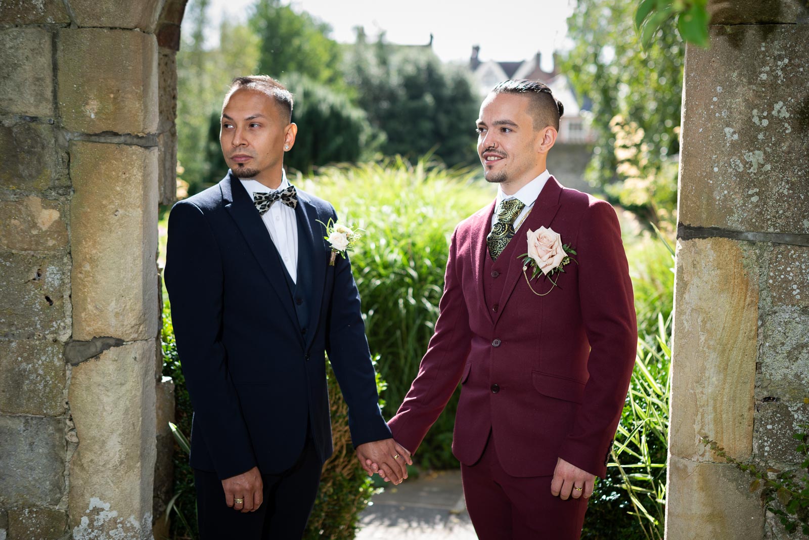 Ady and Jose look off camera in one of the beautiful arches at South Grange after their wedding at Lewes Registry Office.