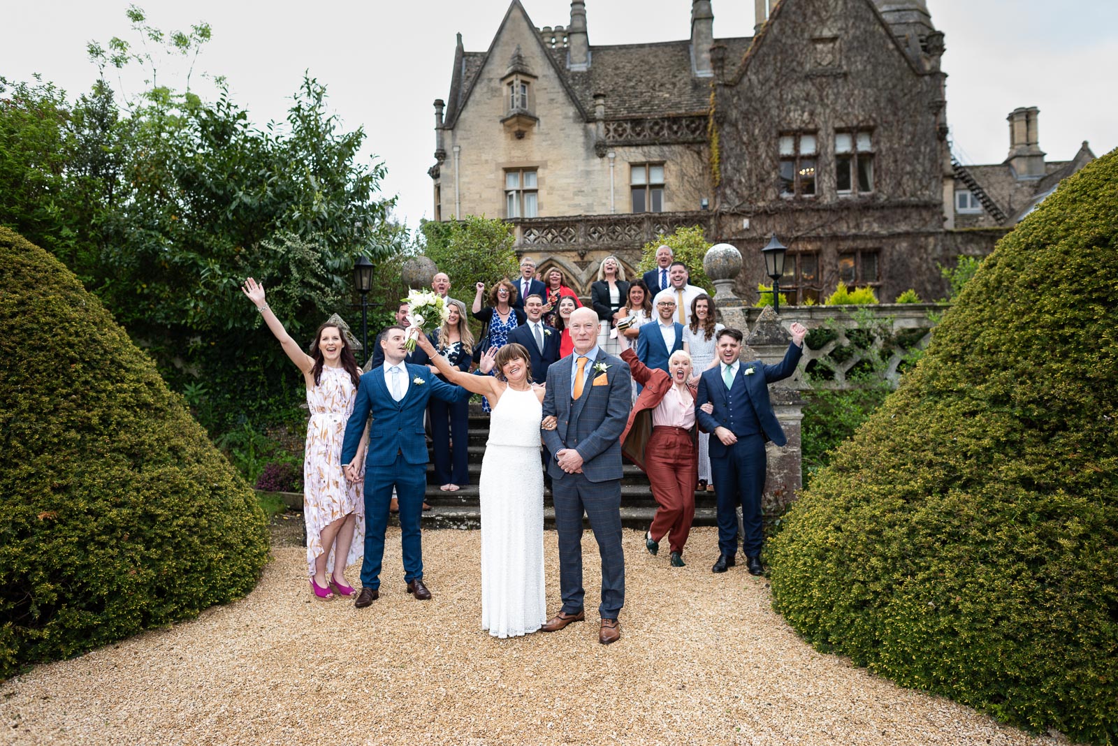 Carmen and Jeff cheer with their family and friends outside Manor by the Lake in Cheltenham.