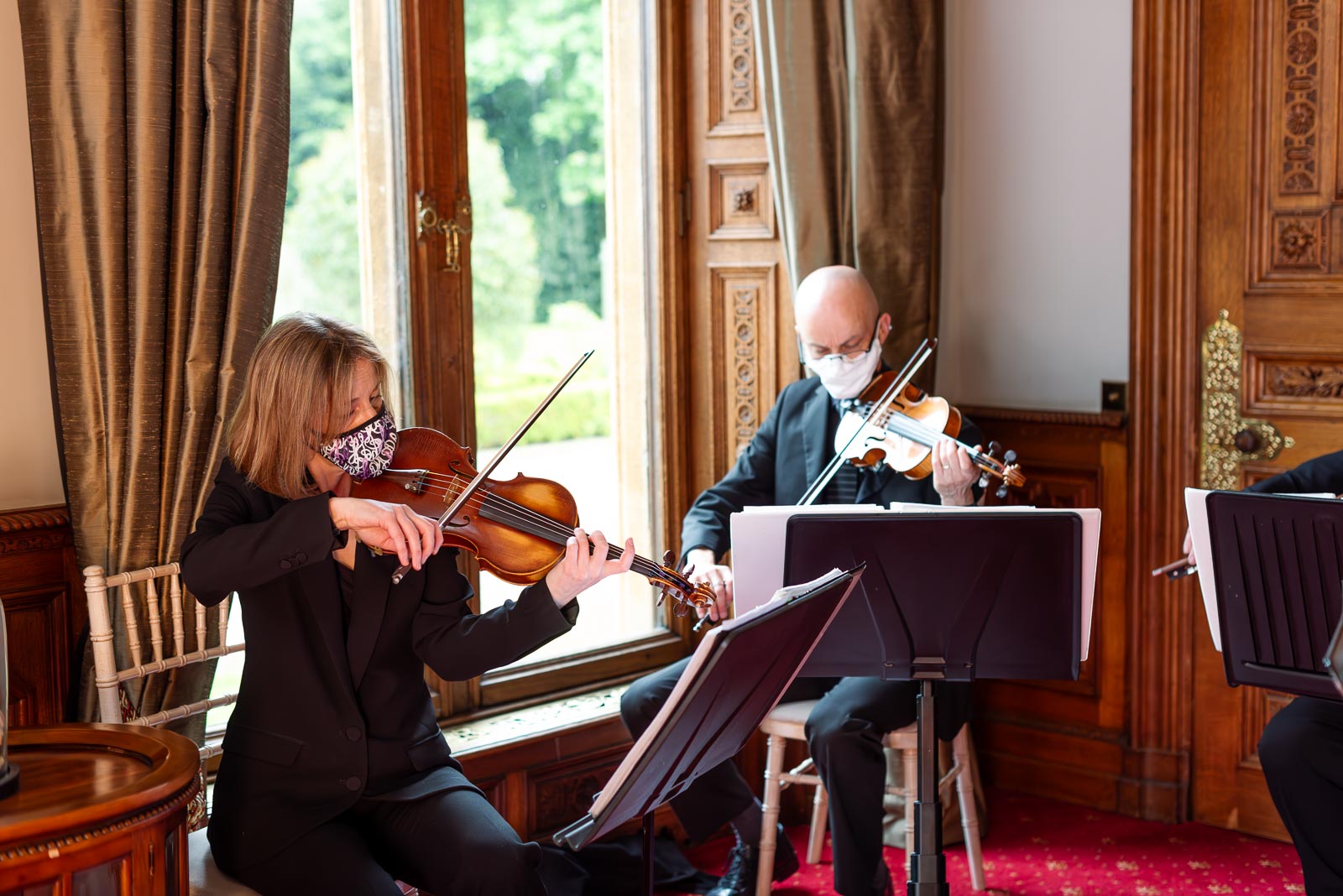 A string quartet play at Carmen and Jeff's wedding in Manor by the Lake in Cheltenham.