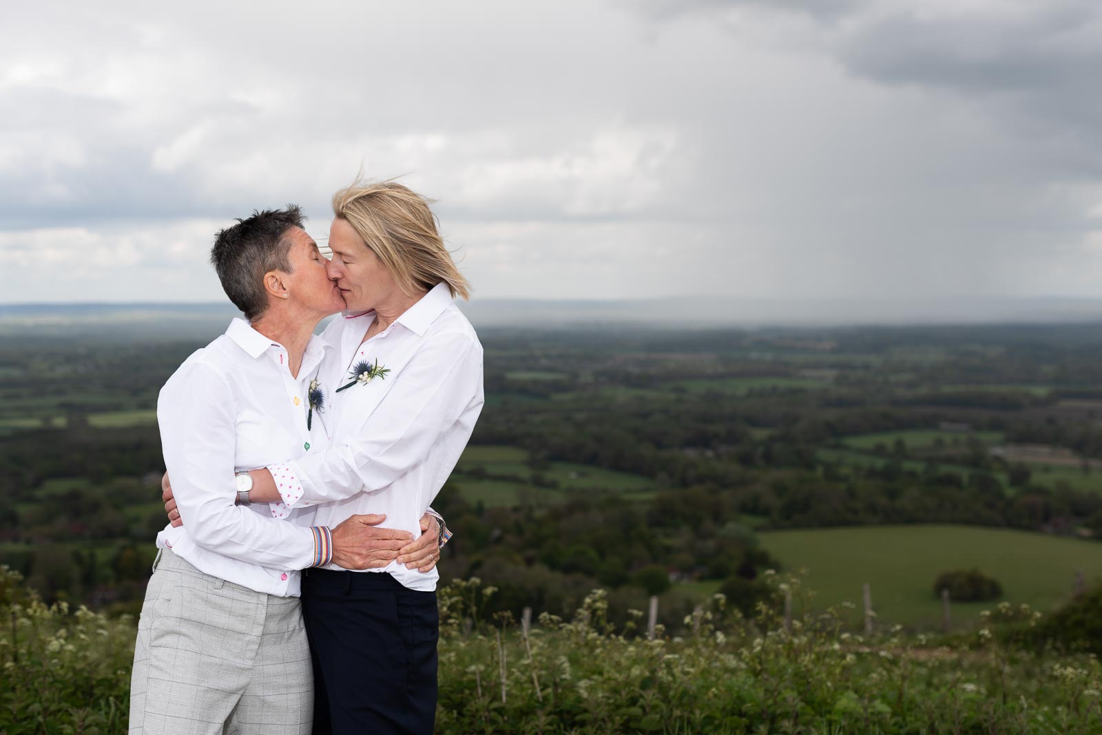 Kate and Sam embrace at Ditchling Beacon in Lewes.