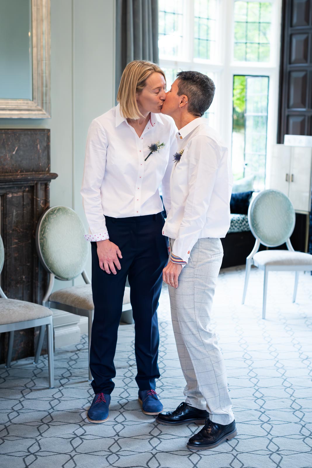 Kate and Sam embrace in the Ainsworth Room at Lewes Registry Office after their wedding.