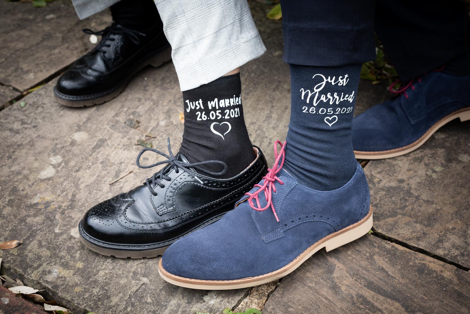 Kate and Sam show their matching just married socks in Southover Grange after their wedding in Lewes Register Office.