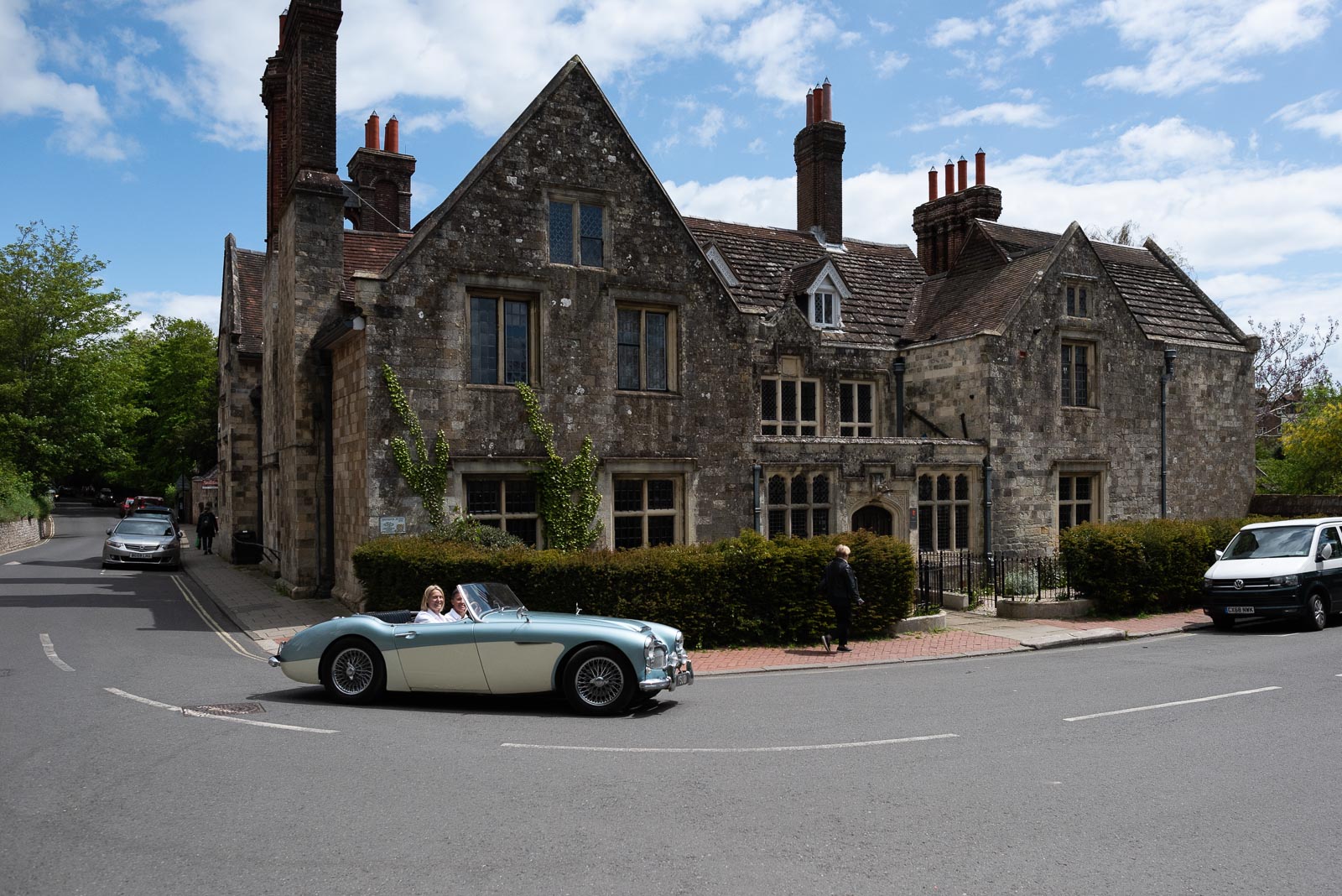 Kate and Sam drive past Lewes Register Office in their wedding car.