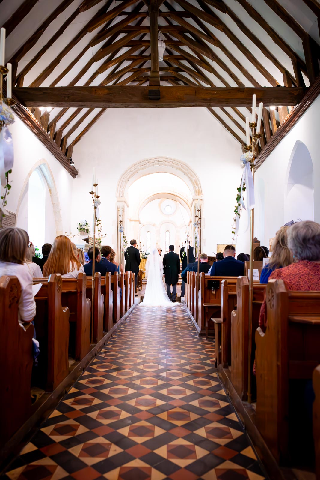 Lily and Callum arrive at the top of the aisle at St Nicholas Church in Iford before their wedding.