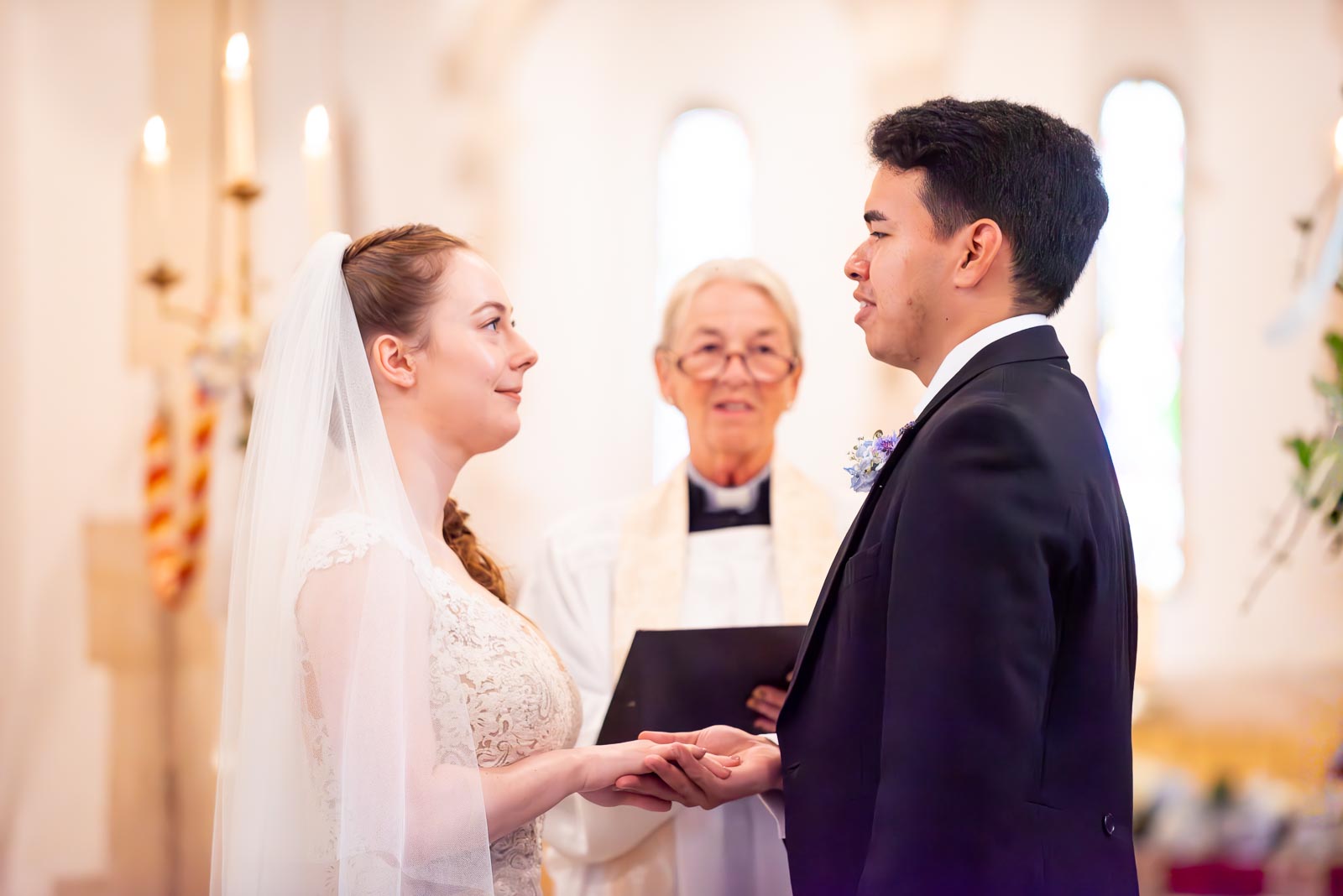 Callum says his wedding vows to Lily in St Nicholas Church in Iford.