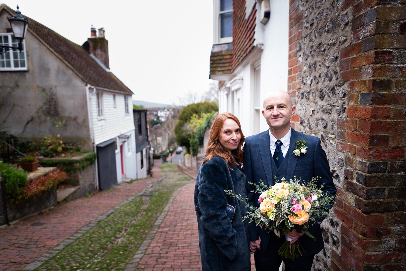 Melanie and Ryan pose on Keere street after their wedding in Lewes Register Office.