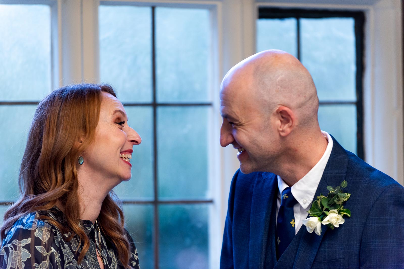 Melanie and Ryan enjoy a funny moment at their ceremony in the Evelyn Room at Lewes Register Office.