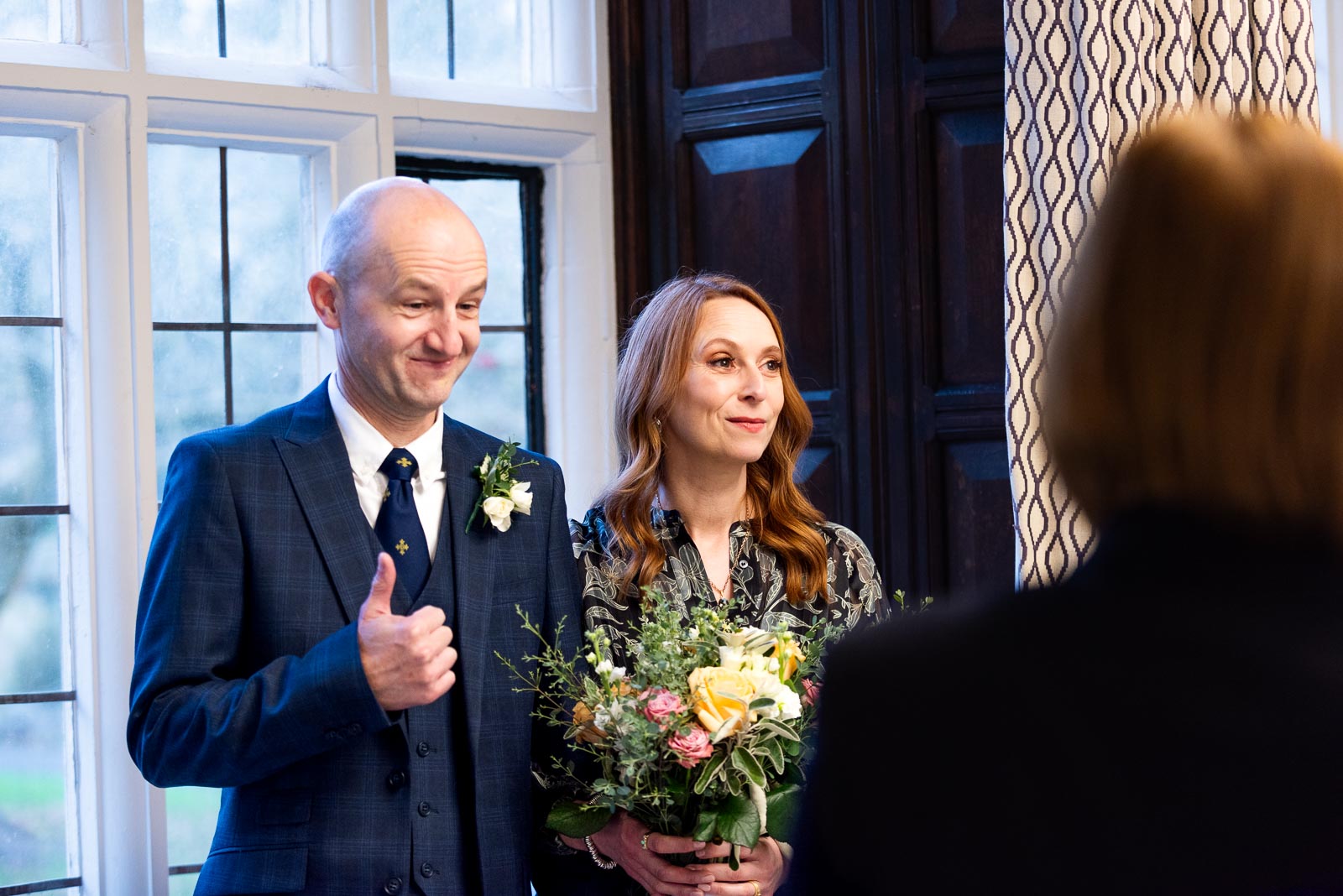 Melanie and Ryan enjoy a funny moment at their ceremony in the Evelyn Room at Lewes Register Office.