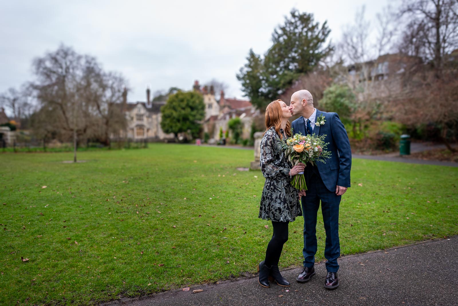 Melanie and Ryan embrace in Southover Grange after their wedding at Lewes Register Office.