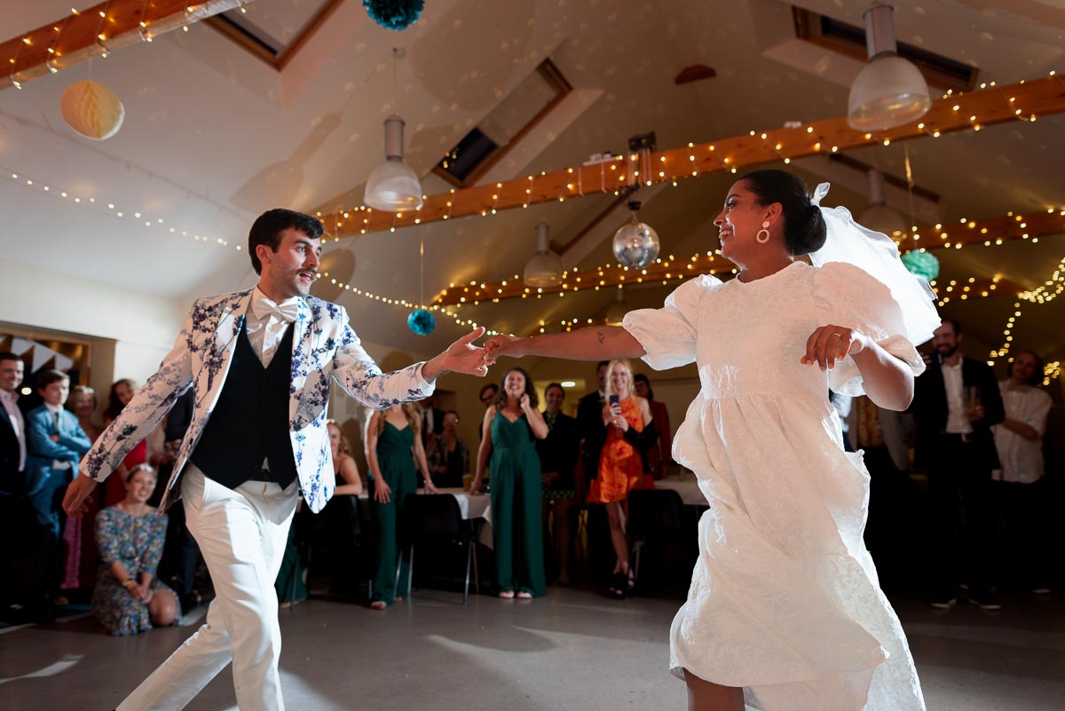 Olivia and Edward enjoy the first dance at Beechwood Hall near Lewes after getting married at Southover Grange in Lewes. 