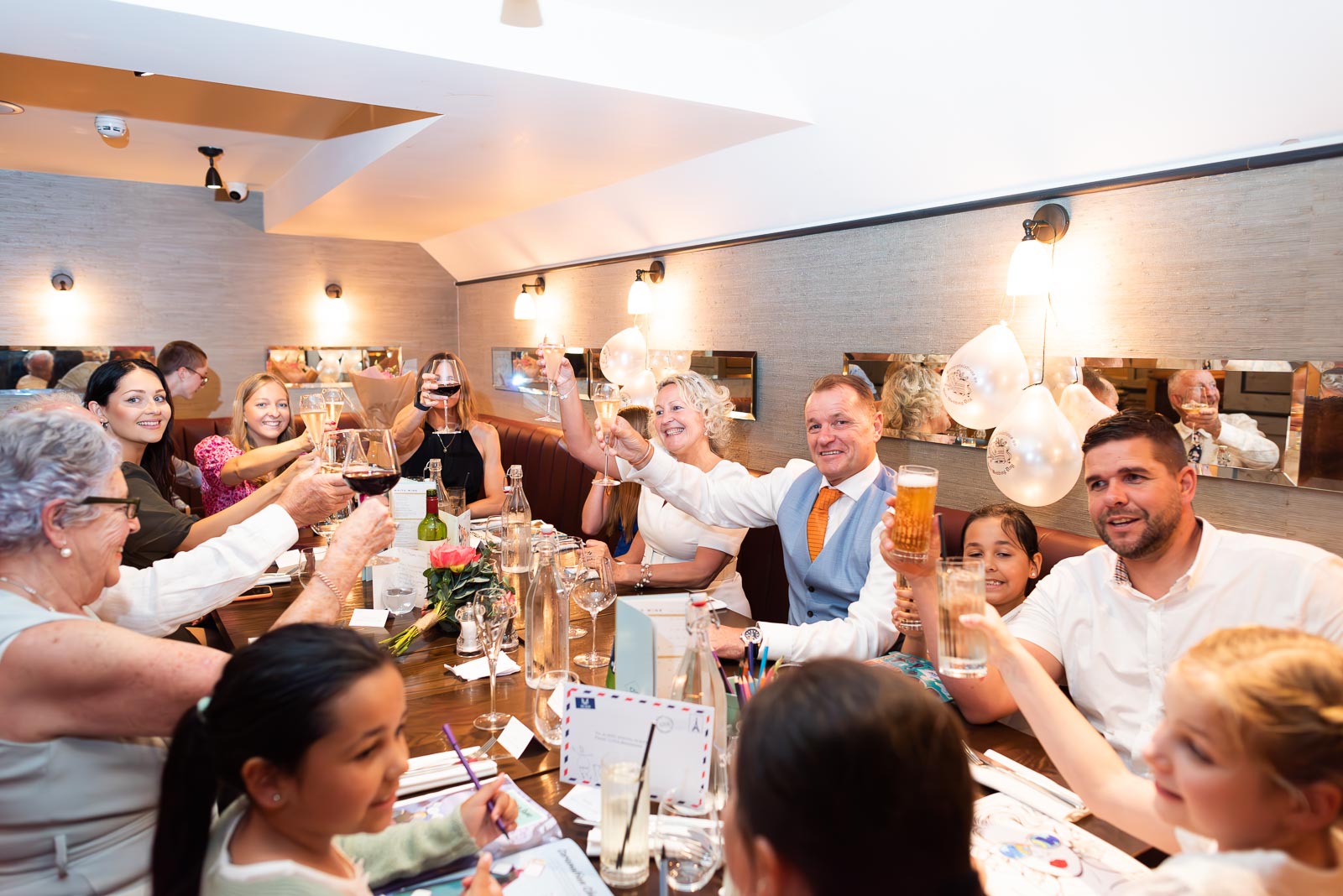 Martin Joanne and their family toast each others health in Cote Restaurant in Lewes.